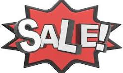 Bold red sale sign with white letters.